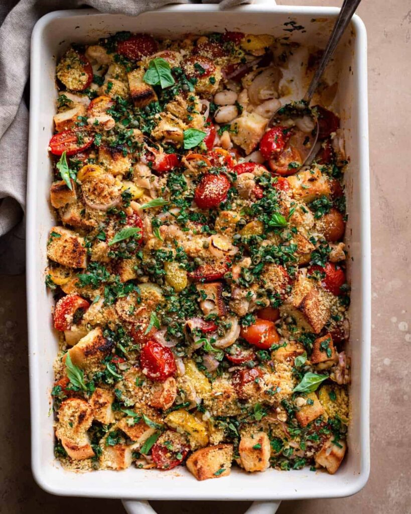 tomato and white bean casserole with spoon dug in scaled